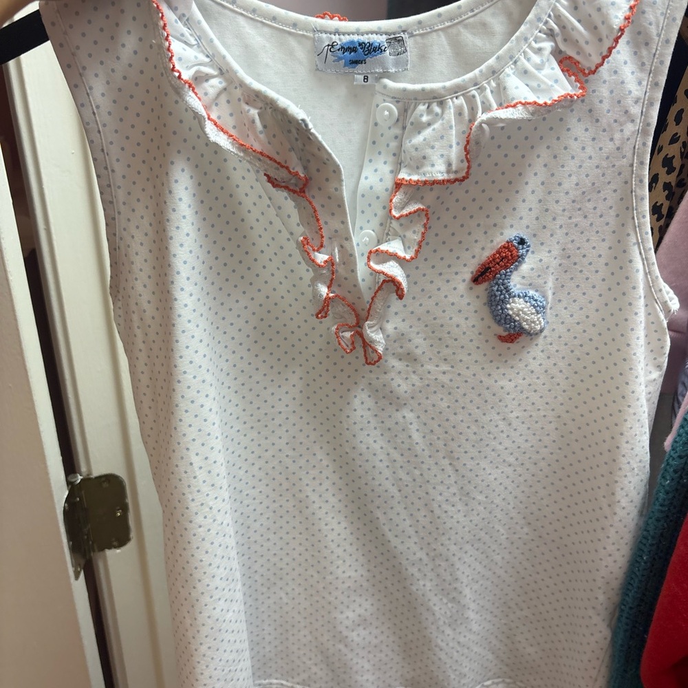 White Sleeveless Top with Ruffle Trim